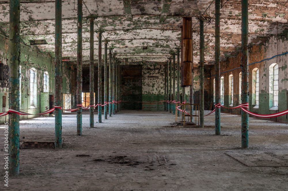 An abandoned old factory made of red bricks - a spinning mill in Poland