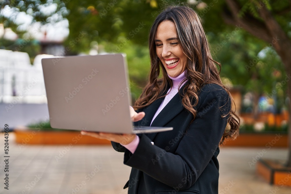 Young hispanic woman smiling confident using laptop at park Young hispanic woman smiling confident using laptop at park