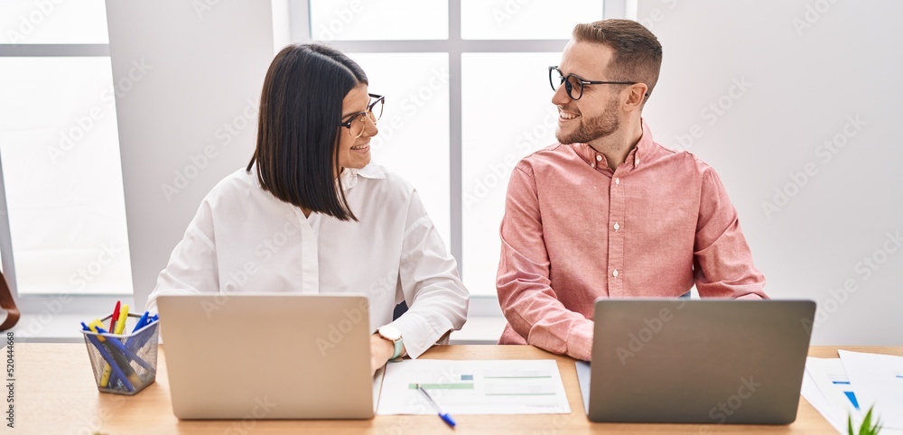 Man and woman business workers smiling confident working at office Man and woman business workers smiling confident working at office