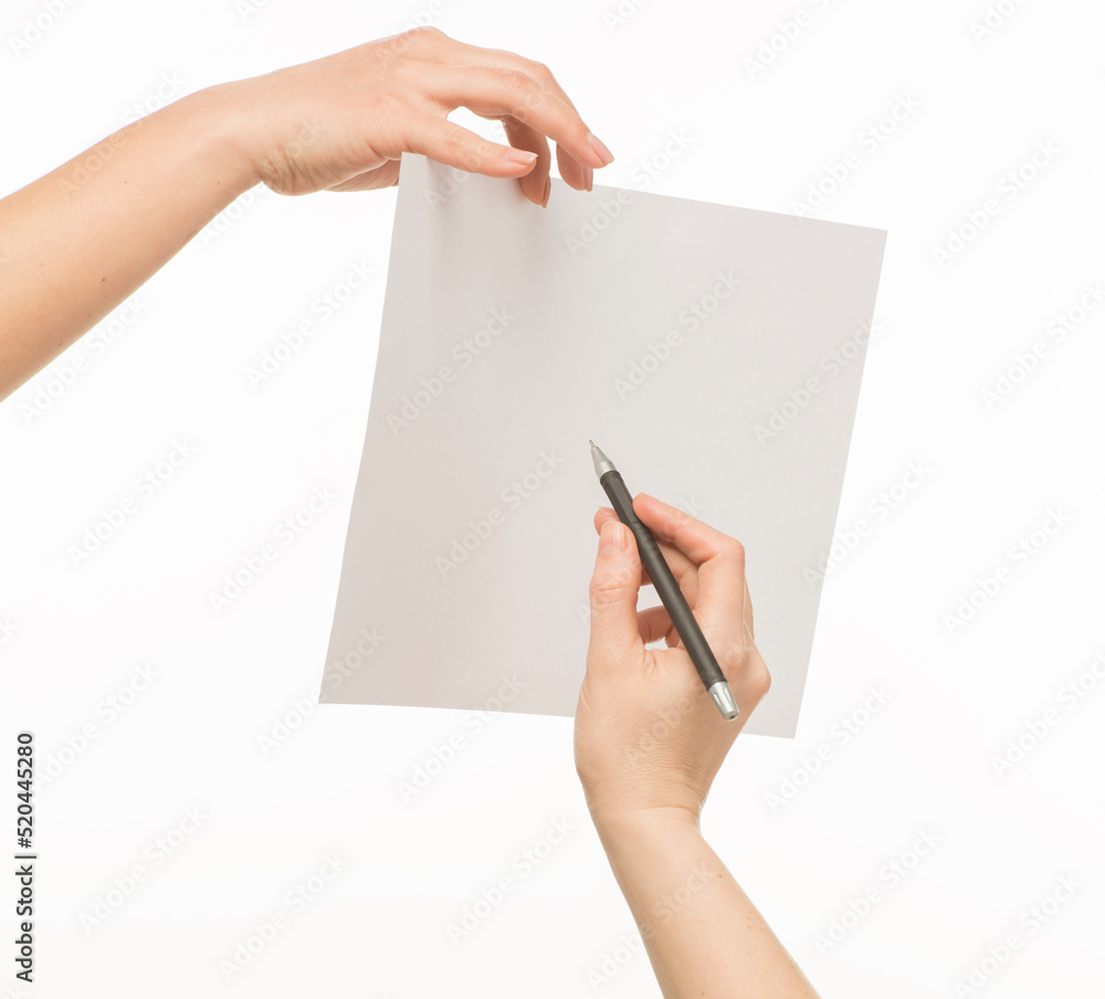 a hand with a pen writes on a clean sheet. a hand holds a pen next to a blank sheet of paper held by the other hand. Isolated on white background a hand with a pen writes on a clean sheet. a hand holds a pen next to a blank sheet of paper held by the other hand. Isolated on white background