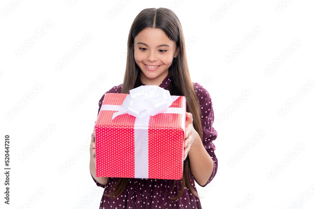 Emotional teenager child hold gift on birthday. Funny kid girl holding gift boxes celebrating happy New Year or Christmas. Portrait of happy smiling teenage child girl. Emotional teenager child hold gift on birthday. Funny kid girl holding gift boxes celebrating happy New Year or Christmas. Portrait of happy smiling teenage child girl.