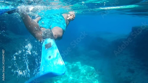 black man snorkeling in the sea