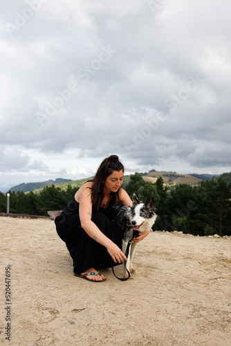 portrait of a woman with her border collie dog