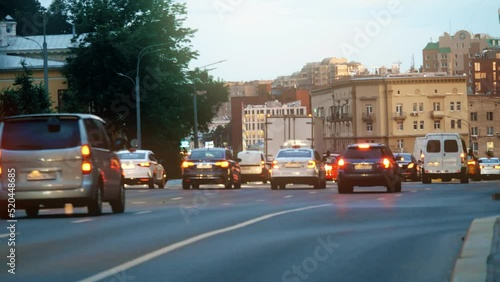Moscow centre cityscape behind blurred road traffic in the evening
