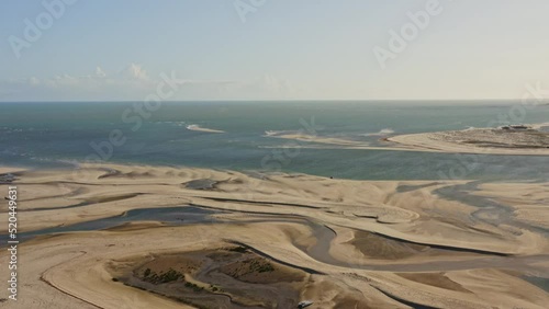 Abstract pattern in sand banks exposed under low tide on Brazil coastline; drone photo