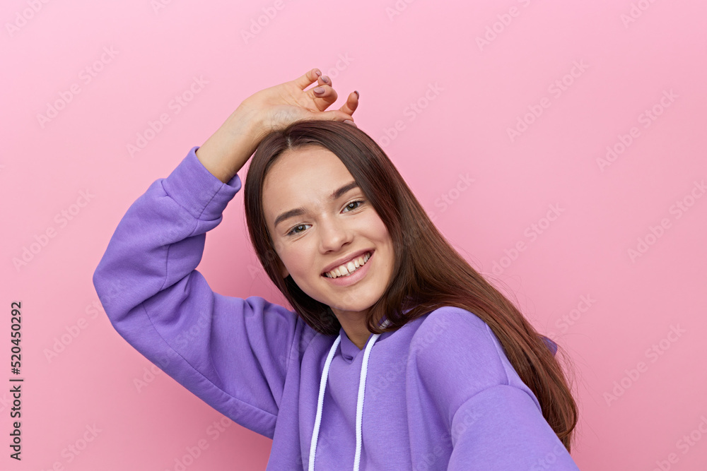 an emotional woman stands full-face on a white background in a purple suit, smiling happily, raising one hand and putting it on her head, and calmly lowered the other down an emotional woman stands full-face on a white background in a purple suit, smiling happily, raising one hand and putting it on her head, and calmly lowered the other down