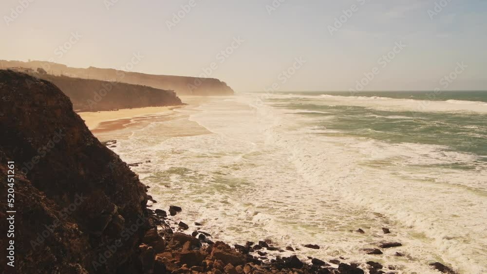 Aerial Drone View of Praia Grande Sandy Beach with Cliffs, showing Coastal Scenery and Coastline at Sintra, Lisbon, Portugal, a Beautiful Popular Tourist Holiday Destination in Europe Aerial Drone View of Praia Grande Sandy Beach with Cliffs, showing Coastal Scenery and Coastline at Sintra, Lisbon, Portugal, a Beautiful Popular Tourist Holiday Destination in Europe