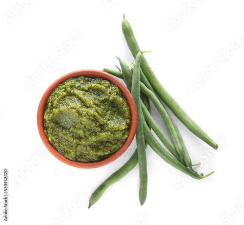 Delicious vegetable puree with green beans on white background, top view. Healthy food