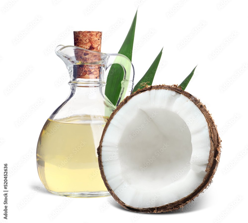 Bottle of coconut cooking oil and fruit on white background Bottle of coconut cooking oil and fruit on white background