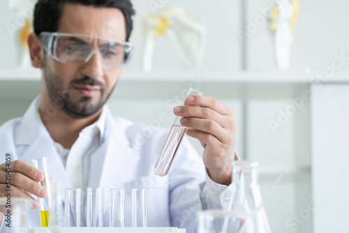 Male Scientist Looking Vaccine