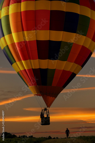 Hot Air Balloon Floats Low at Sunset