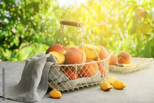 Basket with ripe peaches on...