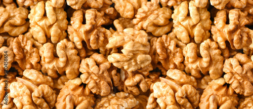 Fotografía Many tasty walnuts as background, top view