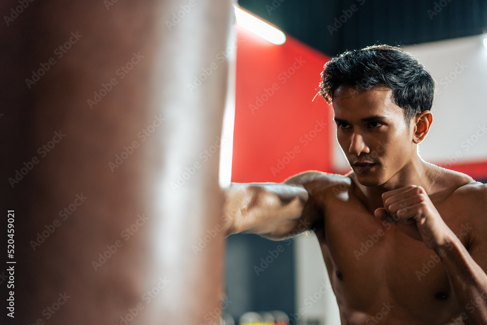 Asian active professional sport young man exercising in fitness gym. Asian active professional sport young man exercising in fitness gym.