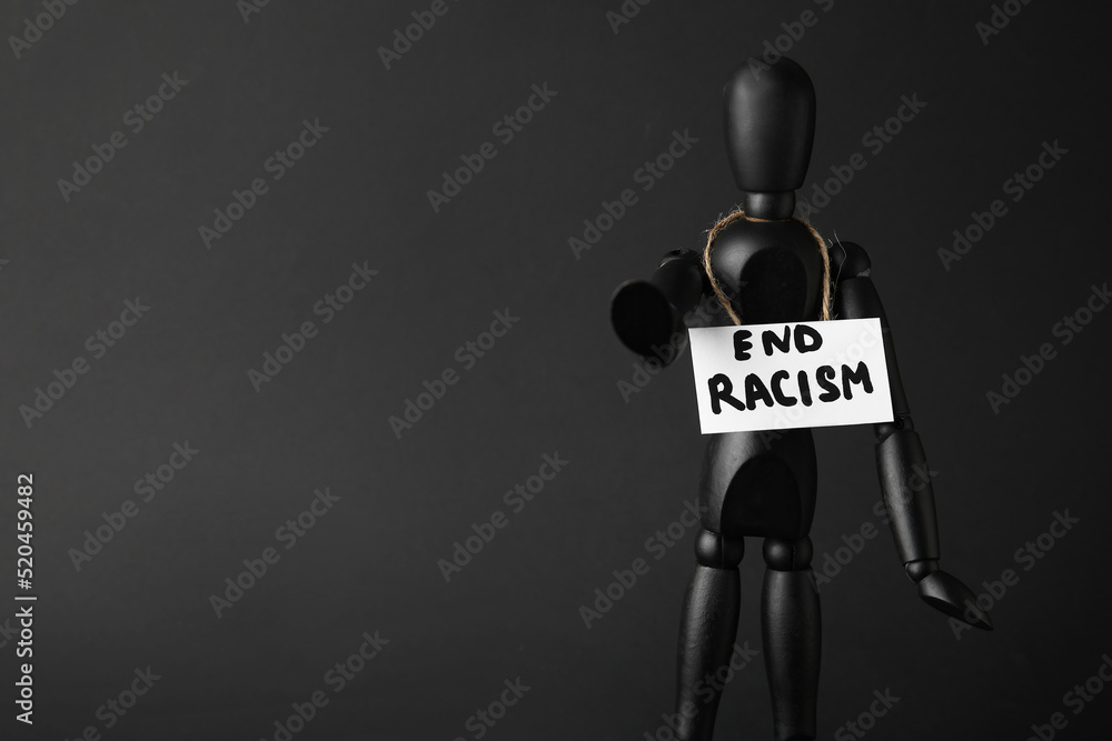 Naklejka na ściany i meble | Black mannequin and paper sheet with text END  RACISM on dark background