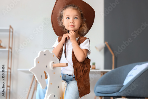 Cute little girl in hat and...