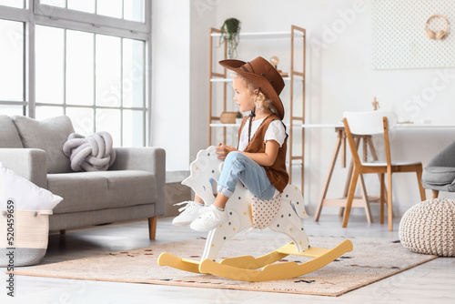 Cute little girl in hat and...