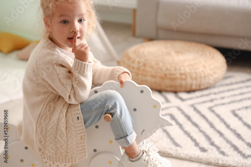Cute little girl playing wi...