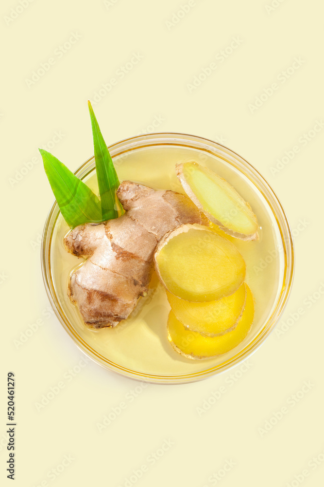 fresh ginger rhizome with slices in a culture dish with ginger oil. 