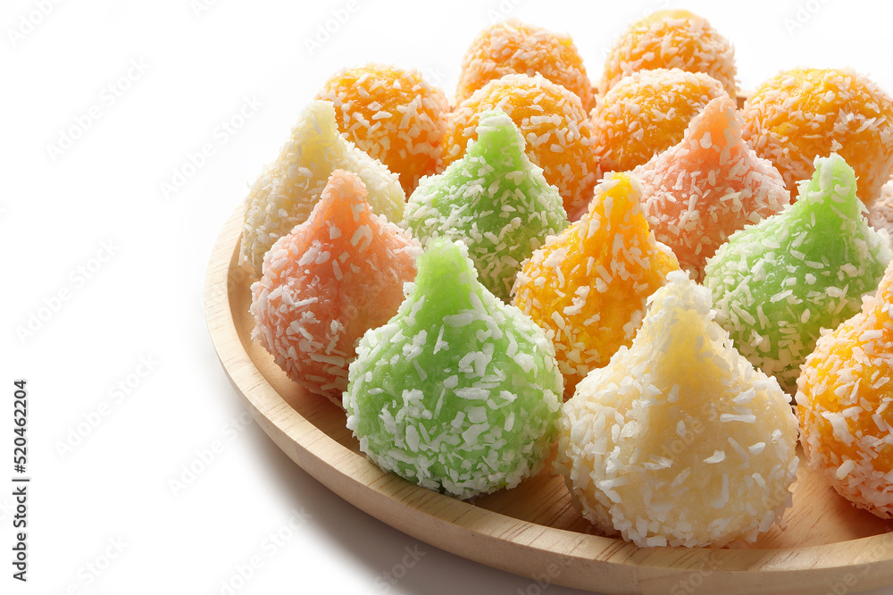 Close up of Indian sweet Motichoor Laddoo or Bundi Laddu. Coconut sweet Laddoo or Nariyal Ladduis on a wooden plate. Close up of Indian sweet Motichoor Laddoo or Bundi Laddu. Coconut sweet Laddoo or Nariyal Ladduis on a wooden plate.