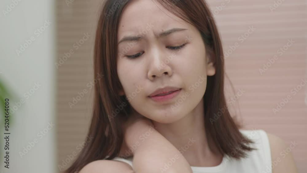Young Asian woman suffering from skin problems. Worried Asian lady upset with dry fragile skin looking in mirror, unhappy stressed woman checking wrinkles troubled with acnes touching face. Young Asian woman suffering from skin problems. Worried Asian lady upset with dry fragile skin looking in mirror, unhappy stressed woman checking wrinkles troubled with acnes touching face.