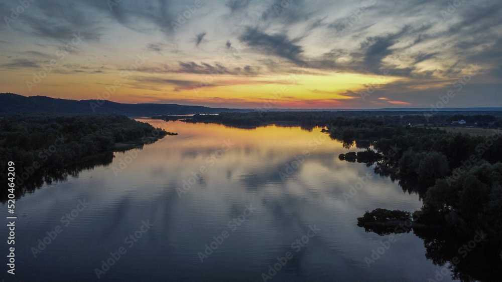 Fototapeta premium the Dnieper river flows among the forests and fields, ukraine filming from a drone. view from above