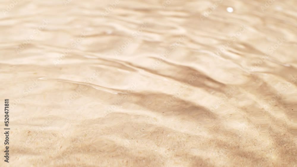 Super slow motion of water waves with sand texture. Filmed on high speed cinema camera, 1000 fps. Super slow motion of water waves with sand texture. Filmed on high speed cinema camera, 1000 fps.