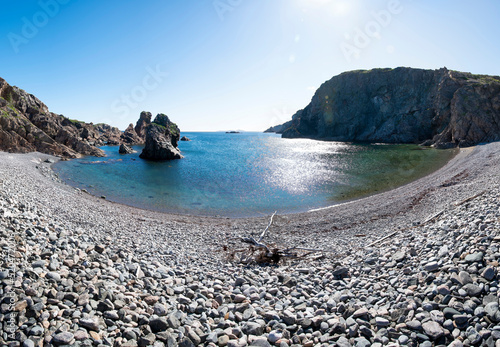 A panoramic view from the rocky beach at Spiller's Cove near Twillingate, Newfoundland on a bright sunny day. photo