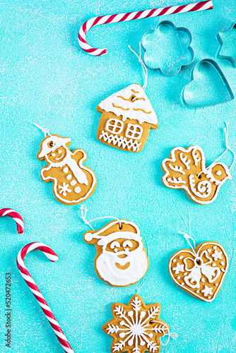 Christmas homemade gingerbread cookies on blue background. Top view