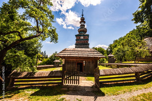 The Greek Catholic wooden church of the Protection of the Most Holy Mother of God from Mikulasova in Saris museum in Bardejov spa, Slovakia photo