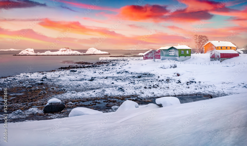 Sunrise in Justad fishing village. Great winter view of Vestvagoy island with colorful wooden houses. Splendid outdoor scene of Lofoten Islands, Norway, Europe. Traveling concept background.