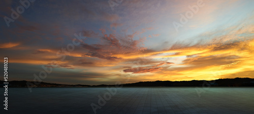 Empty concrete cement floor with sunset sky . © jamesteohart