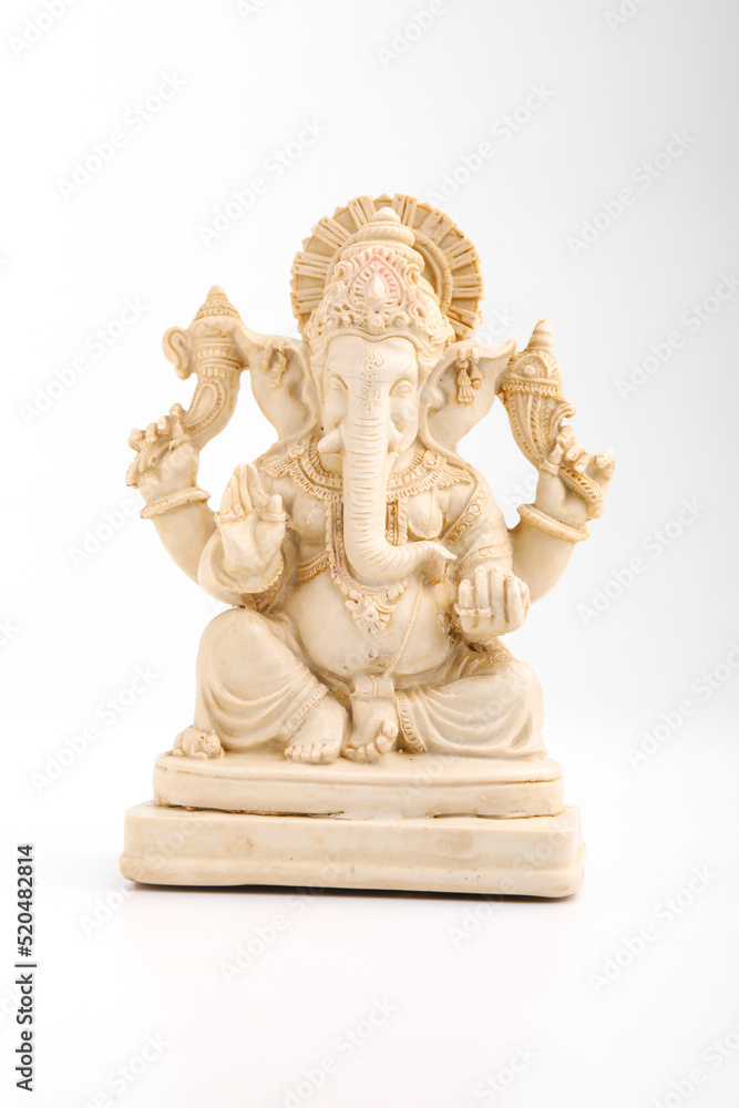 antique lord ganesha sculpture on white background.