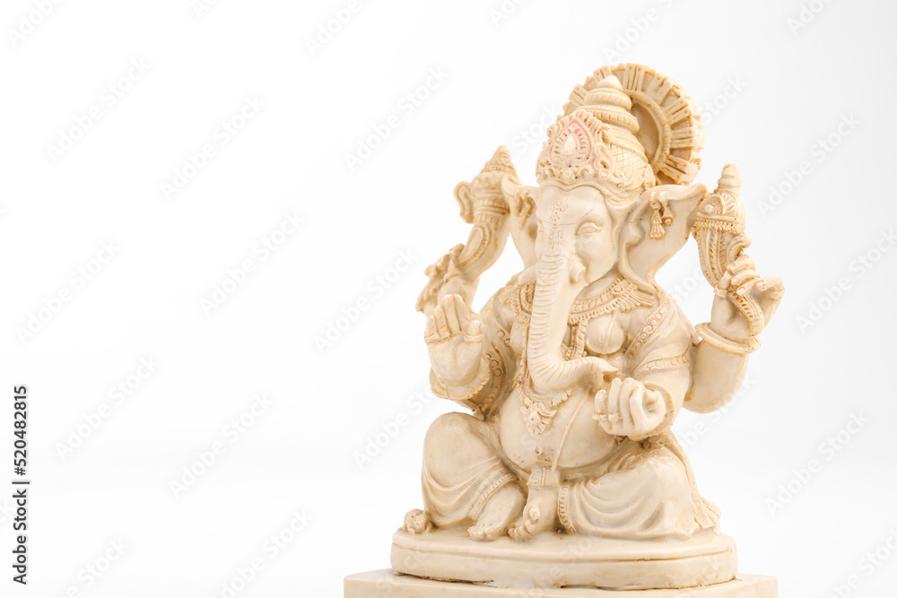 antique lord ganesha sculpture on white background.
