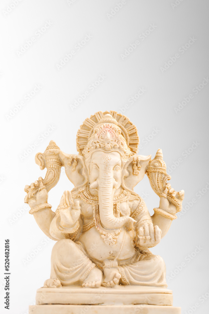 antique lord ganesha sculpture on white background. antique lord ganesha sculpture on white background.