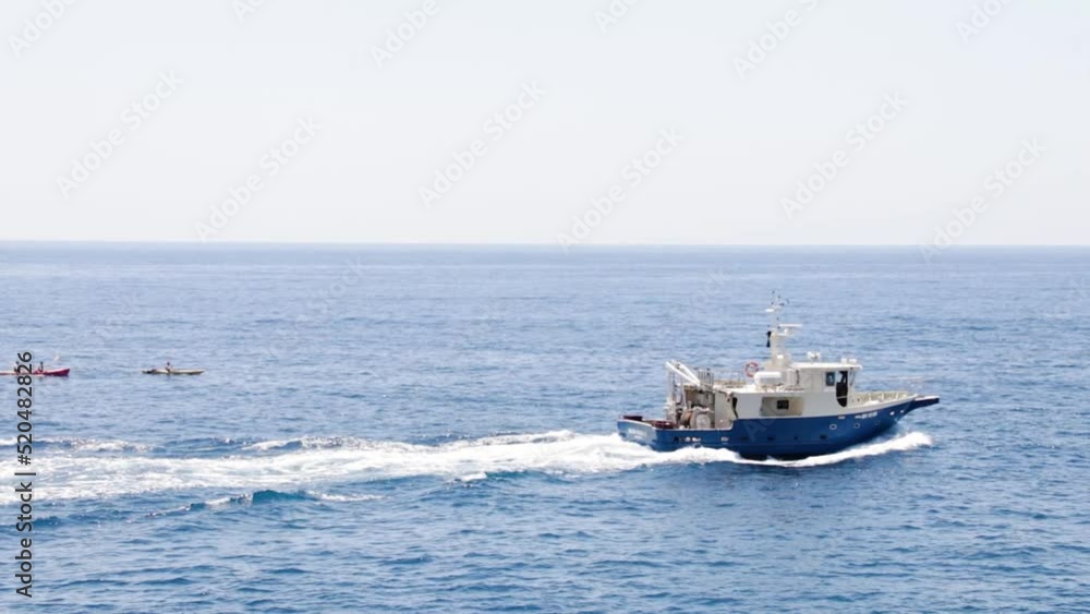 Fishing boat going out to the sea to fish on a beautiful day in Dubrovnik, Croatia Fishing boat going out to the sea to fish on a beautiful day in Dubrovnik, Croatia