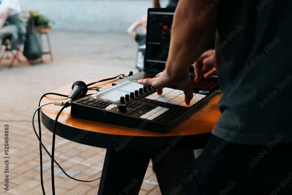 Αυτοκόλλητο Side view of unrecognizable street musician beatmaker playing hip hop beats on d