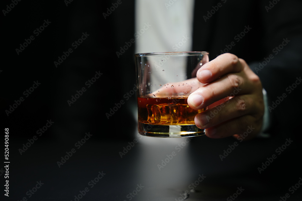 Businessmen in suits drinking whiskey Businessmen in suits drinking whiskey