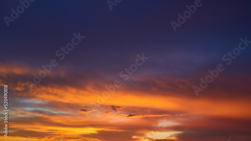 Real amazing sunrise or sunset sky with gentle colorful clouds