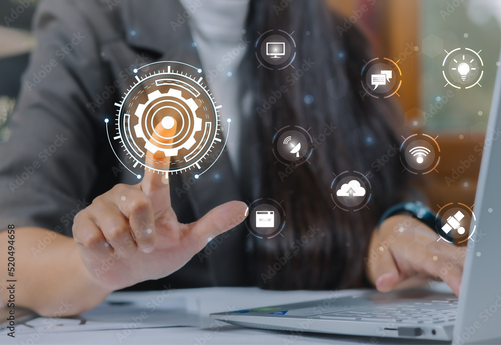 Obraz premium Woman touching a network technology concept on a touch screen with his finger