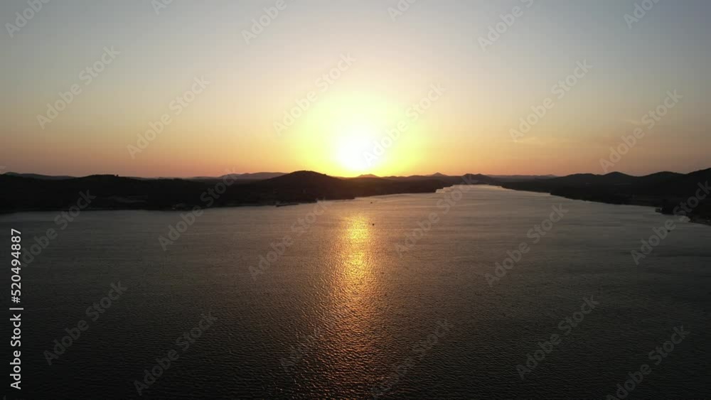 Flying into the Sunset. Golden sunset above Croatian islands. Calm summer evening, captured by drone. Relaxing Mediterranean Sea footage. Flying into the Sunset. Golden sunset above Croatian islands. Calm summer evening, captured by drone. Relaxing Mediterranean Sea footage.