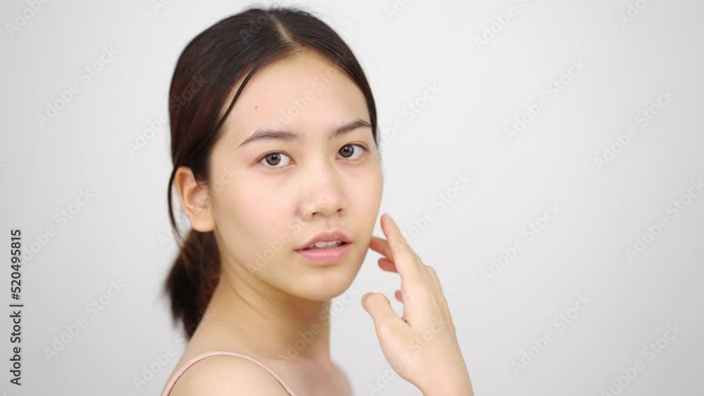 Slow motion of Asian girl beautiful woman face close up looking camera portrait healthy skin natural make up clean beauty fresh skin young female beautiful model. Slow motion of Asian girl beautiful woman face close up looking camera portrait healthy skin natural make up clean beauty fresh skin young female beautiful model.