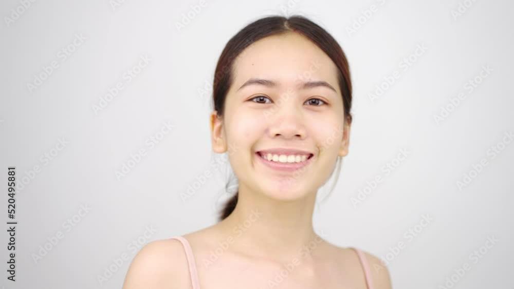 Slow motion of Asian girl beautiful woman face close up looking camera portrait healthy skin natural make up clean beauty fresh skin young female beautiful model. Slow motion of Asian girl beautiful woman face close up looking camera portrait healthy skin natural make up clean beauty fresh skin young female beautiful model.