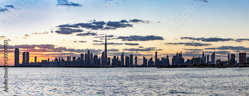 Billede på lærred Skyscrapers skyline of Dubai UAE downtown with Burj Khalifa at sunset