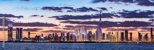 Fototapeta Skyscrapers skyline of Dubai UAE downtown with Burj Khalifa at sunset