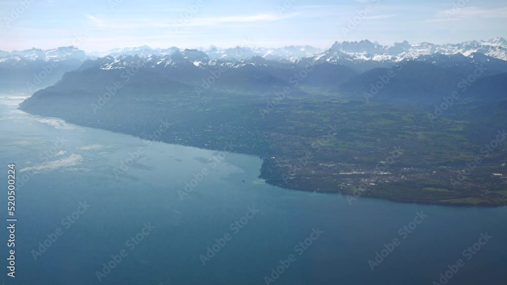 French coast of Geneva (Leman) lake including Evian and Thonon-les-Bains with the Alps in the background, aerial view
