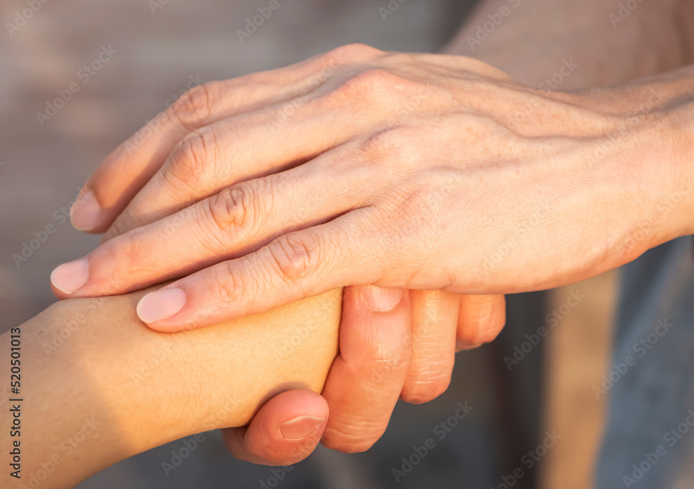 Close up of Man hand as Lending a helping hand as trust together with compassion concept Close up of Man hand as Lending a helping hand as trust together with compassion concept