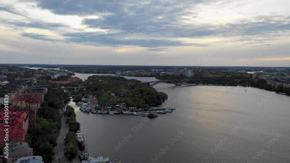 circular drone flight at sunset over Stockholm city and harbor on the Baltic Sea in Sweden circular drone flight at sunset over Stockholm city and harbor on the Baltic Sea in Sweden
