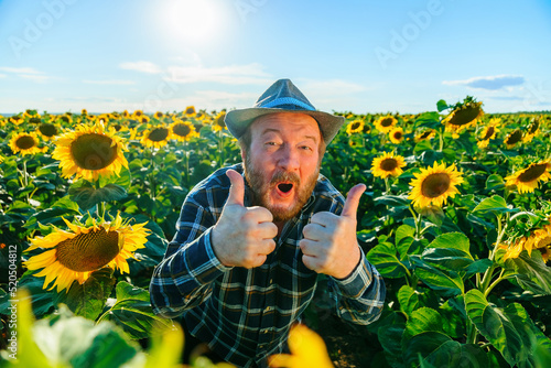 Принти на полотні emotive surprised shocked bearded young farmer male show thumbs up opens mouth w