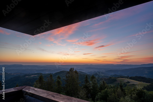 Fototapeta Naklejka Na Ścianę i Meble -  Beautiful view of the mountains at sunrise from the observation tower